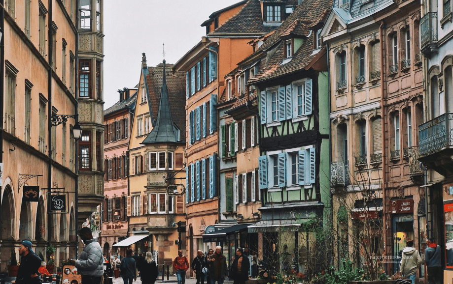 Colorful historic houses along a picturesque street in Colmar, France free fall tech wallpaper